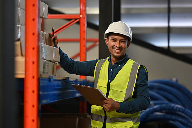 istock Confident logistics worker with safety equipment posing for a portrait in an organized warehouse 2252680281