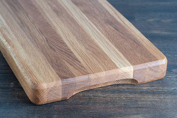 istock Wooden cutting board on wooden table background 2252680723