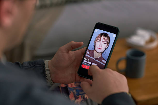 istock Caucasian Young Adult Man Using Dating App on Smartphone While Sitting Indoors 2252681089