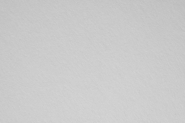 istock White textured paper surface creating an abstract clean background for art, or rustic product display design, 2252681355