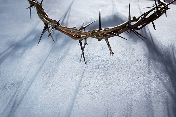 istock Crown of thorns casting a distinct shadow a white background, creating a symbolic easter image of suffering, sacrifice, and remembrance Copy good space text for friday 2252681357