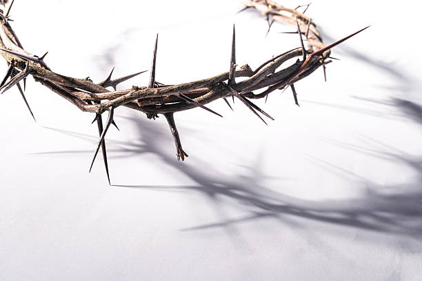 istock Crown of thorns casting a distinct shadow a white background, creating a symbolic easter image of suffering, sacrifice, and remembrance Copy good text for space friday 2252681362