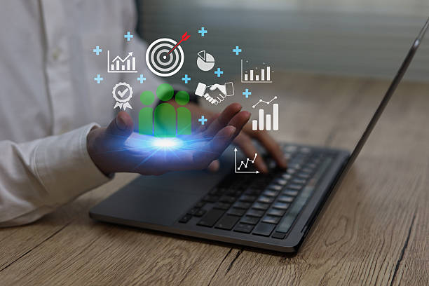 istock Business using laptop hand holding virtual team analytics icons,Concept digital strategy, business growth data analysis teamwork, performance management corporate planning modern technology solutions 2252684566