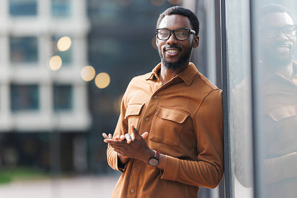 istock Young African American man smiling casually outdoors in a city environment 2252684886