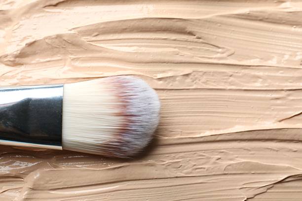 istock Liquid texture foundation with brush. Makeup base, BB cream, smear background 2252685160