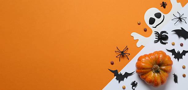 istock Different Halloween decorations including pumpkin, spiders and bats on color background 2252685165