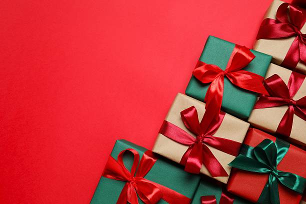 istock Top view of gift boxes tied with bows on red background 2252685543