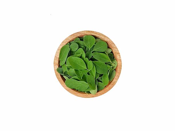 istock Fresh moringa leaves (moringa oleifera) on wooden bowl 2252685870