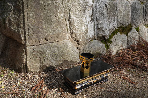 istock A small black and gold object sits on a stone slab 2252689820