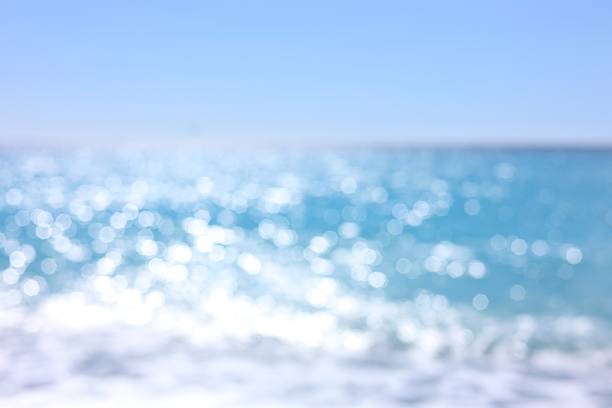 istock Blurred view of wavy sea and blue sky on sunny day 2252690521