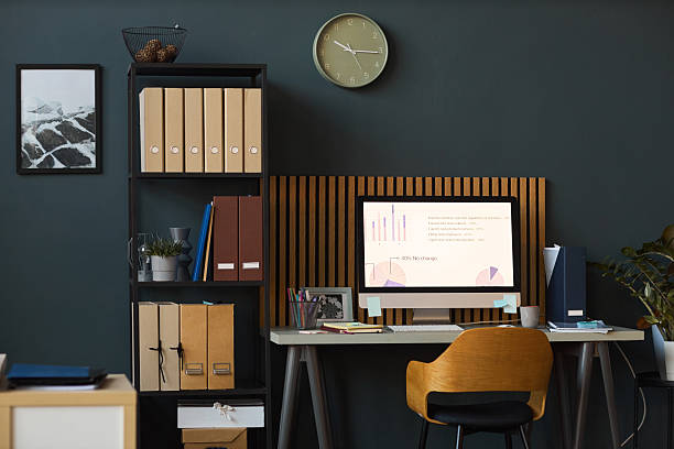 istock Modern Office Desk Displaying Financial Charts on Computer Monitor 2252692090
