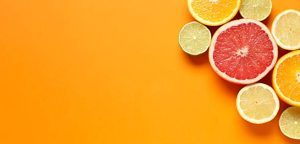 istock Tropical fruits on a colored background. Summer concept. Flat lay, top view, copy space 2252692242