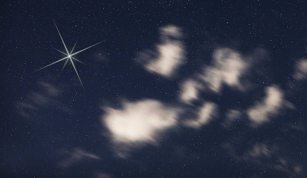 istock Christmas star in the sky with clouds 2252692555