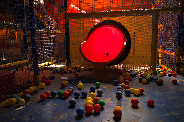 Old amusement park with climbing frame, slide, ball pit, lost in history