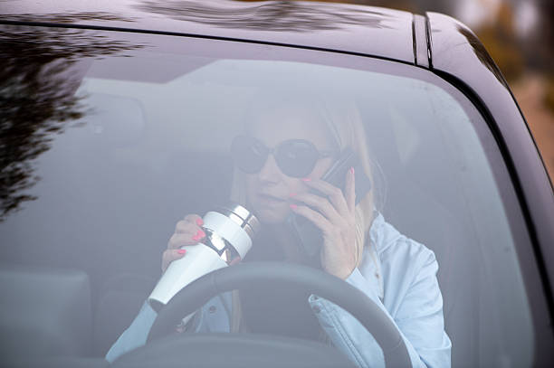 istock Middle Aged Woman Talking On Phone In Car 2252695457