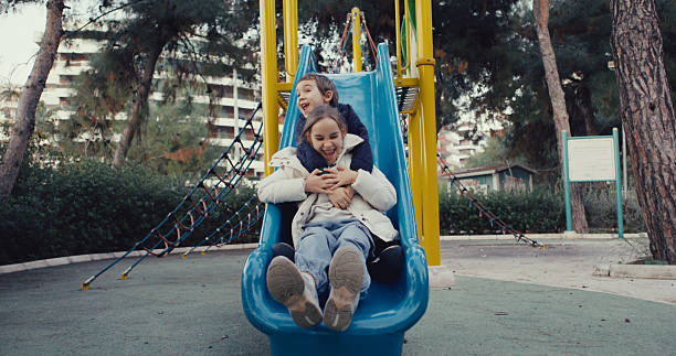 Children having fun and playing in the playground
