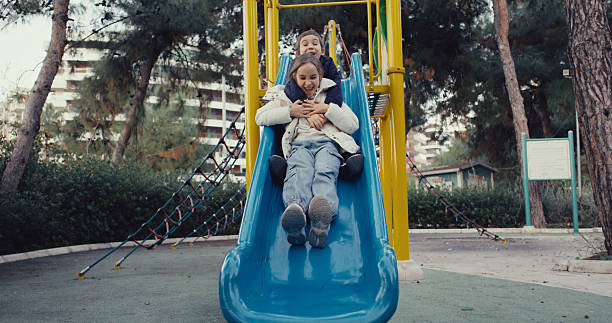 Children having fun and playing in the playground