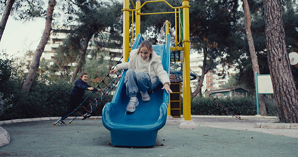 Children having fun and playing in the playground