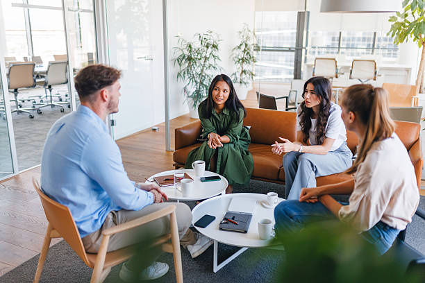 istock Young Diverse Team Discussing Ideas in Corporate Office 2252700028