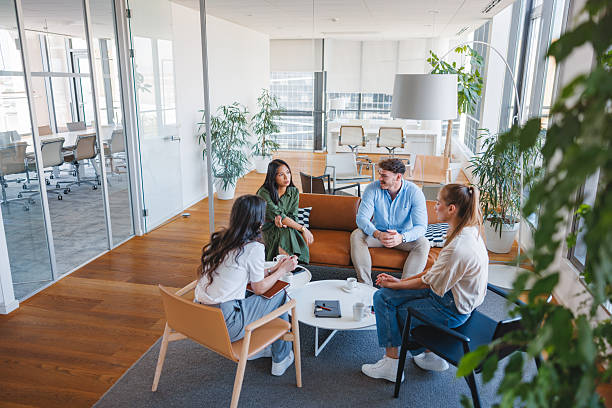 istock Diverse Group of Young Adults Engaging in Office Discussion 2252700078