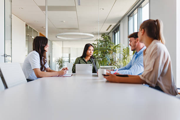istock Young Professionals Engaged in Strategic Meeting at Bright Office 2252700264