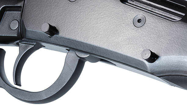 istock Takedown pins on a lever action rifle receiver coming out for diisassembly 2252704233