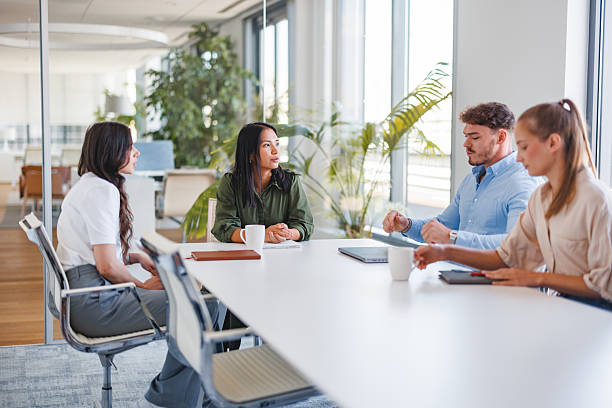 istock Young Business Professionals Discussing Project in Modern Office 2252706920