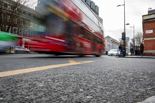 istock Red bus in London with motion blur viewed from a low angle 2252707703