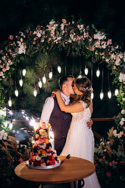 istock newlyweds happily cut and taste the wedding cake 2252707730