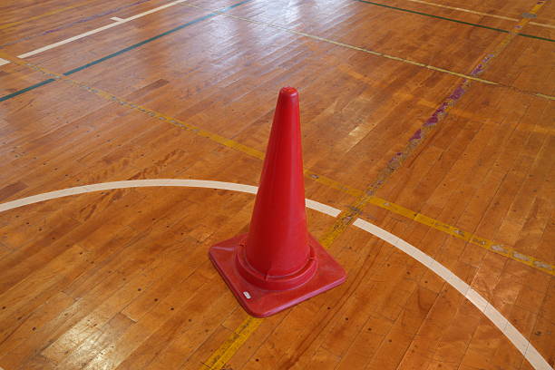 istock A red cone is sitting on a wooden floor 2252708171