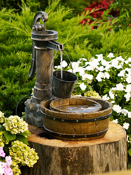Running water fountain in a formal rose garden