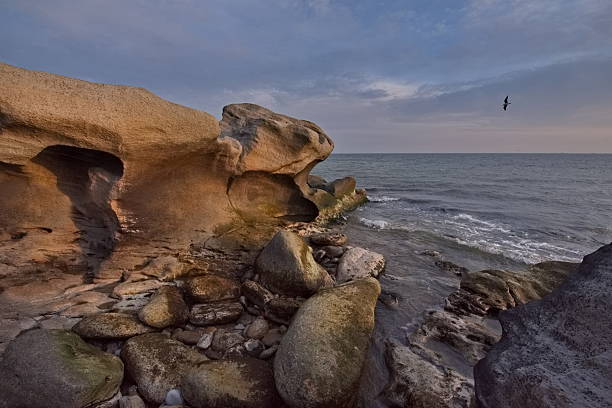 Russia. East Caucasus, Republic of Dagestan. Spring dawn on the shore of the Caspian Sea near the embankment of the city of Makhachkala.