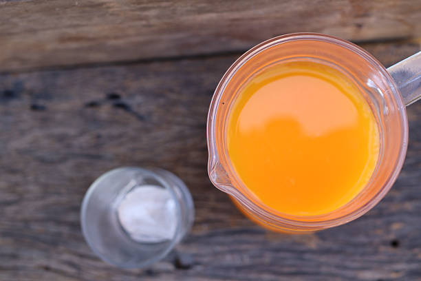 Soft drinks orange juice and iced in glass