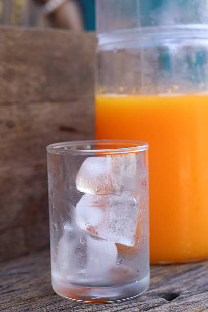 Soft drinks orange juice and iced in glass