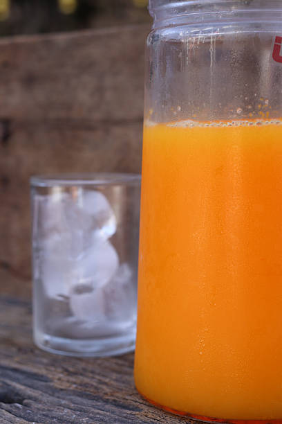 Soft drinks orange juice and iced in glass