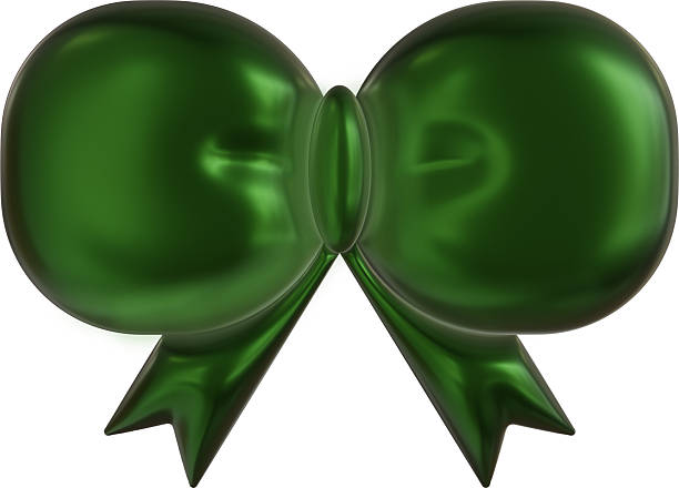 Green Bow on Gift for Christmas with out of focus lights background festive decorations