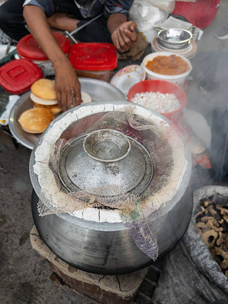 istock Rustic Food Scene: Steaming Rice Cake in a Patil with Toppings Nearby 2252714340