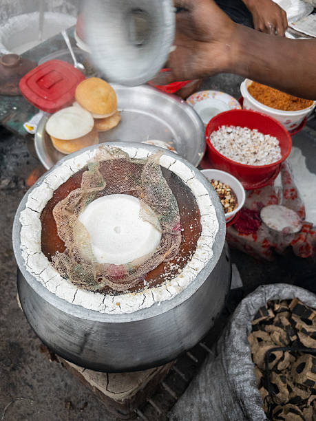 istock Authentic Cooking: Steamed Rice Cake Being Made on a Traditional Metal Pot 2252714342
