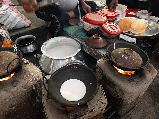 istock Traditional Cooking Method of Bengali Chitoi Pitha in a Rural Stall 2252714409