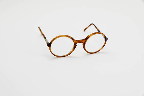 A bunch of old prescription eyeglasses