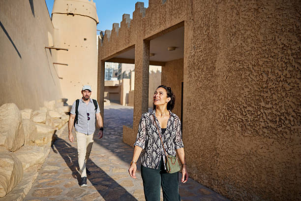 istock Tourists admiring 19th-century Nadji mudbrick architecture 2252715991