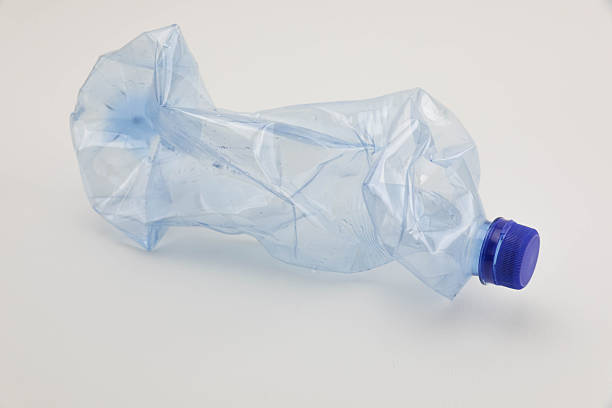 crushed small plastic bottle on white background
