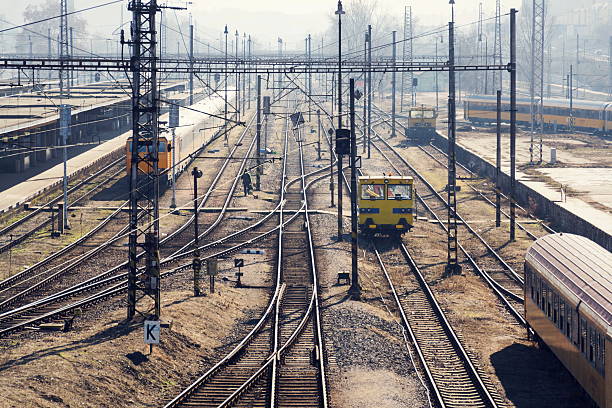 Complicated railway network with power lines and freight wagon for track maintenance, sunny day, high angle view, Smichov, Prague, Czech Republic