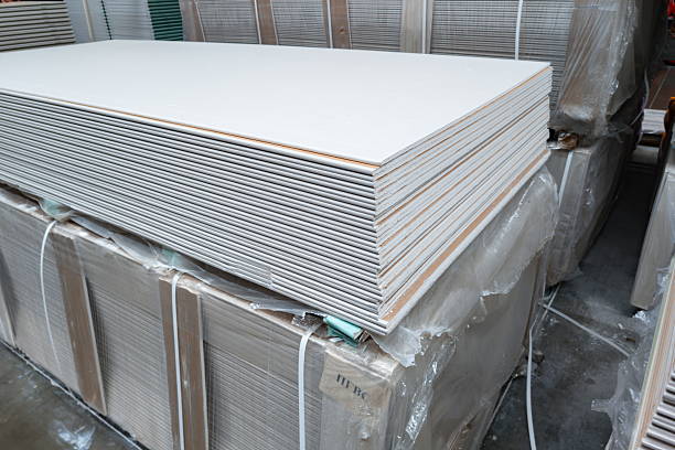 istock Stack of building materials stored in a warehouse during daylight hours for construction projects 2252716149