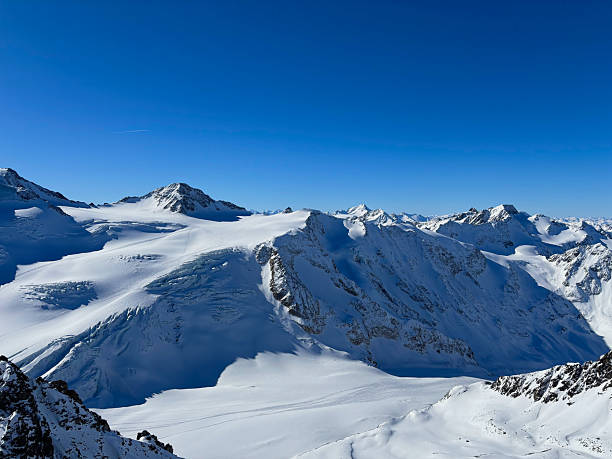 istock Majestic alpine glacier and rugged mountain ridges under a blue sky in Austria 2252716596