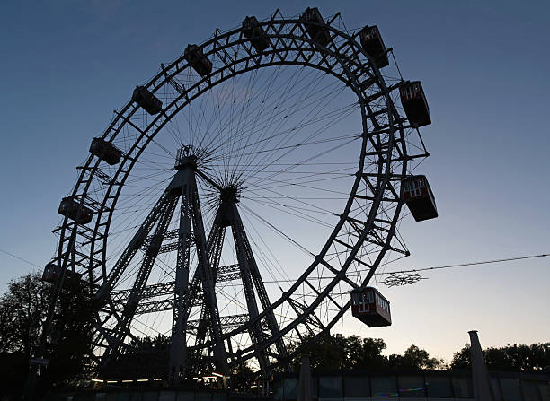 Prater Amusement Park, Vienna, Austria, October 30, 2025. Large illuminated ferris wheel.  Dusk, evening or twilight autumn night outdoors