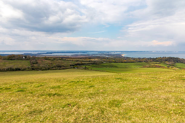 istock Swanage. Ballard Cliff path. Panoramic countryside overlooking distant coastline and open fields 2252719143