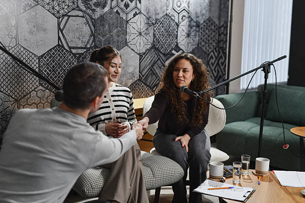 istock Friendly Podcast Studio Scene With Female Hosts Receiving a Guest 2252720680
