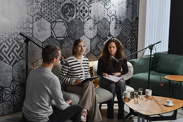 istock Cozy Home-Style Podcast Panel Featuring Friends Sharing Conversation and Laughter 2252720746