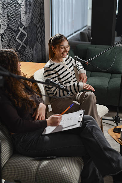 istock Casual Podcast Studio Scene Featuring Host and Guest Sharing Positive Advice 2252720805